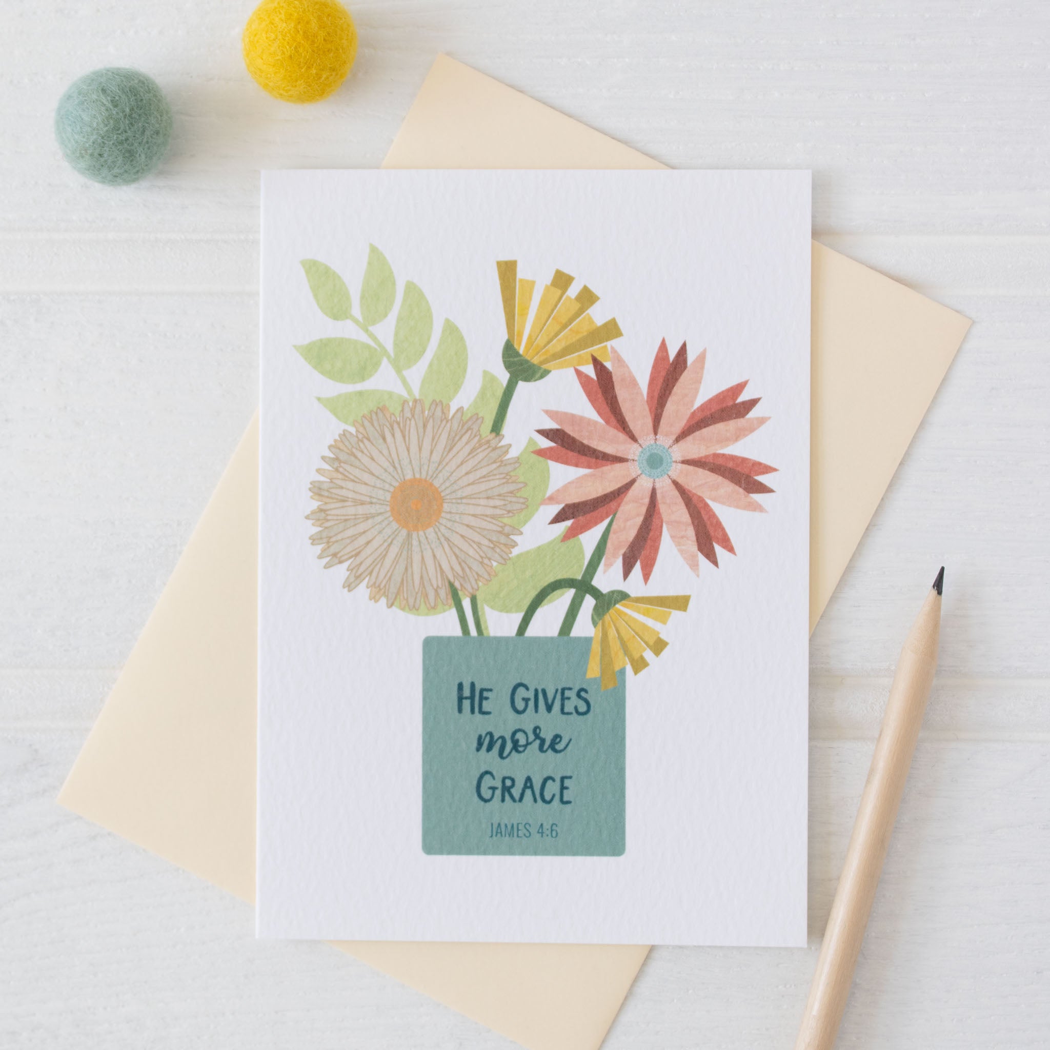 He Gives More Grace Card with white background and envelope