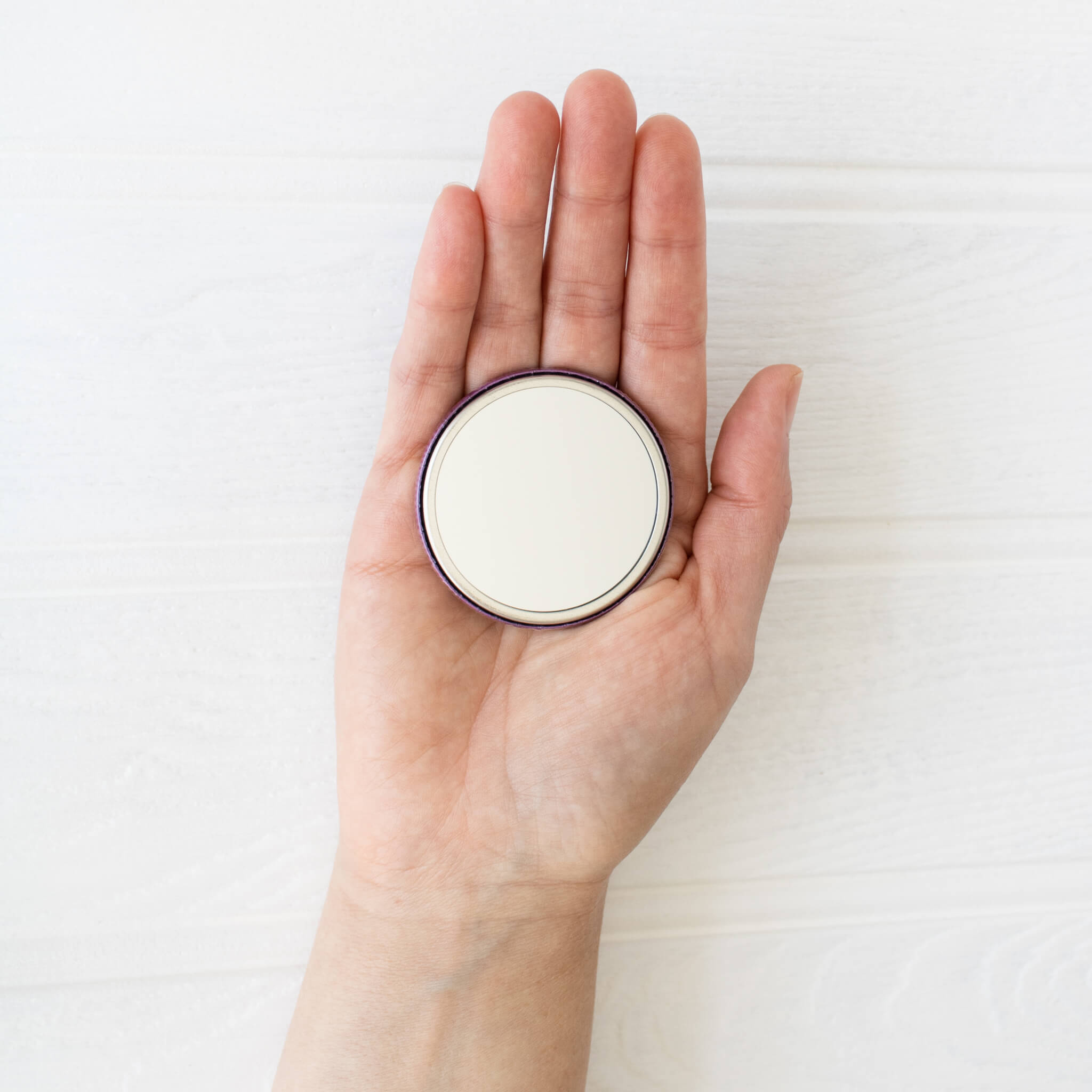 Soli Deo Gloria Pocket Mirror held in hand showing mirror side