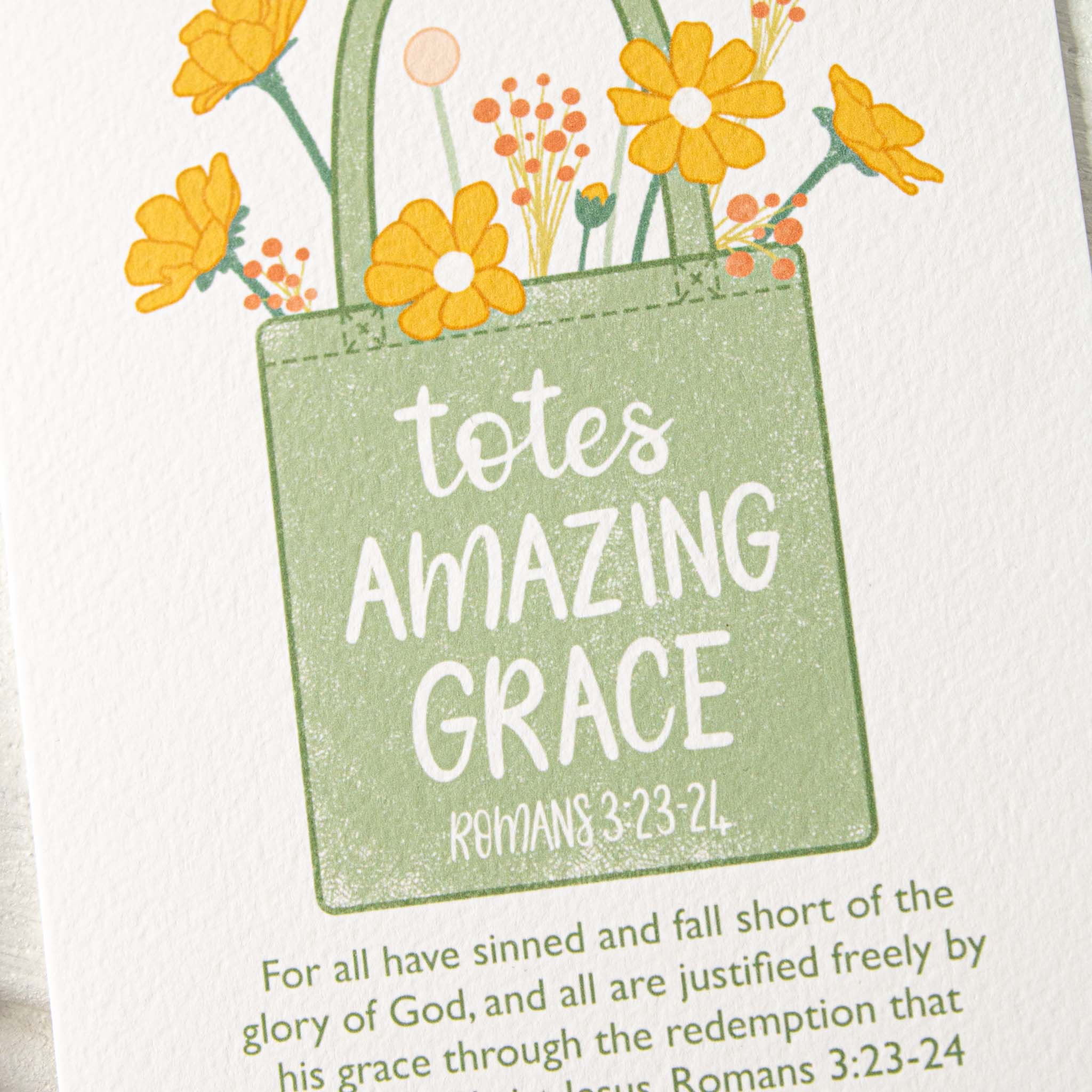 Closeup of the textured Totes Amazing Grace Card